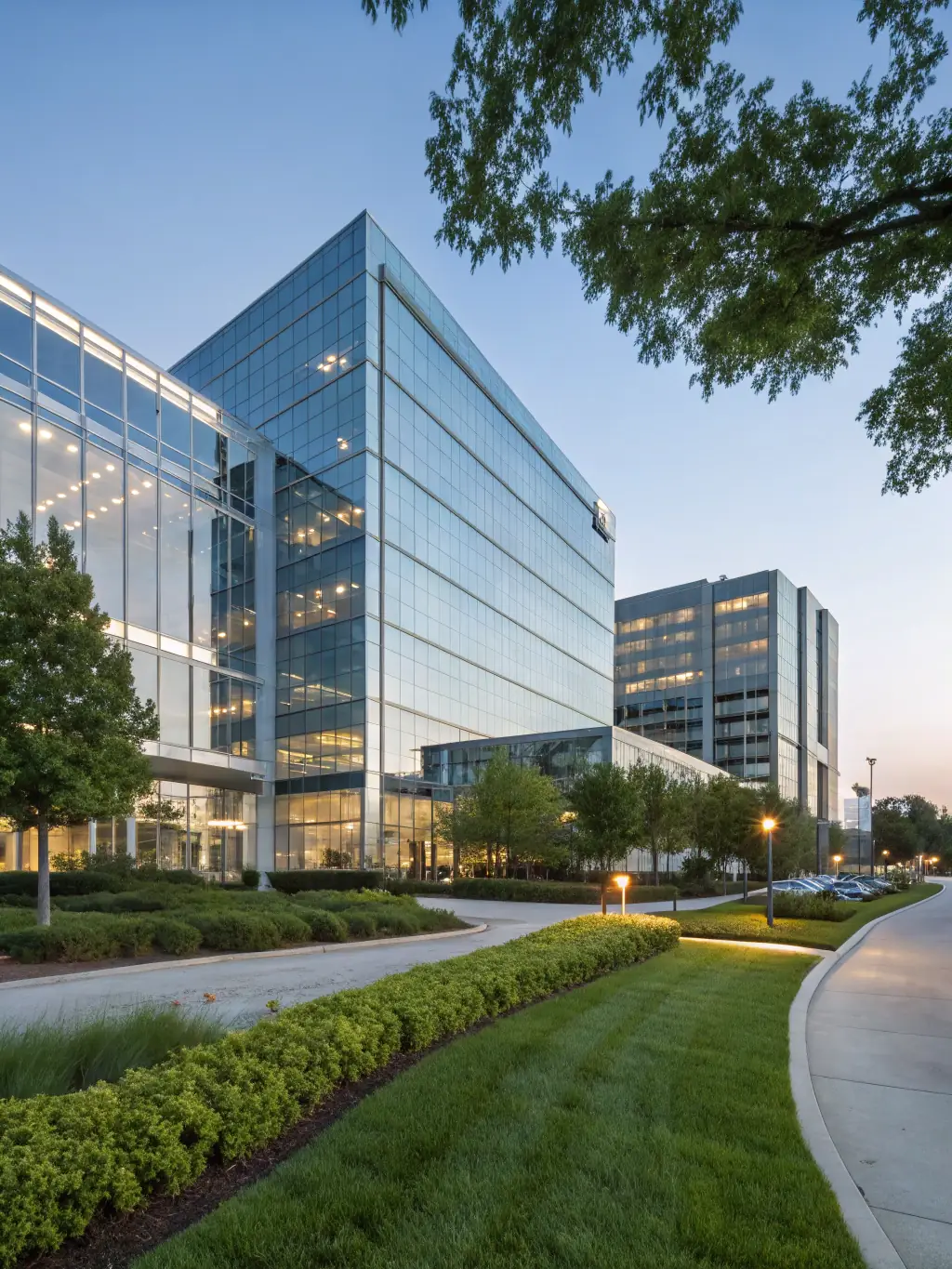A sleek commercial office building with glass facades and modern architecture, representing Evan & Co. Construction's capabilities in commercial construction.